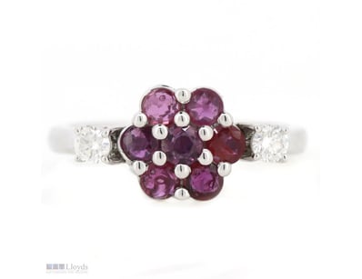 14K WHITE GOLD, RUBY AND DIAMOND, FLOWER RING.    ...