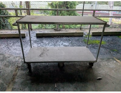Industrial two-tier mobile utility cart featuring ...