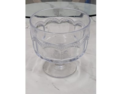 Elegant decorative glass compote bowl featuring a ...