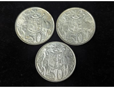 THREE SILVER 1966 ROUND FIFTY CENT COINS

Condit...