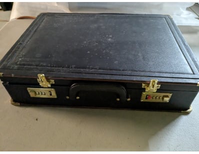 Black leather briefcase with brass combination loc...