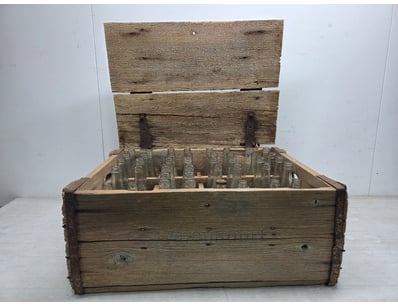 Vintage wooden bottle crate with hinged lid and me...