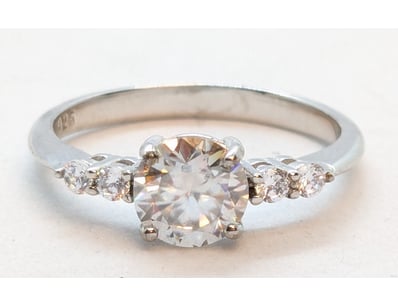 SILVER ROUND BRILLIANT CUT DIAMOND RING

Markings:...