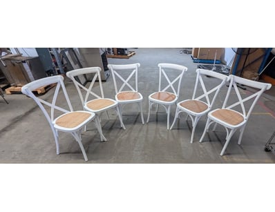 Dining chairs featuring white-painted frames with ...