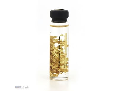 GLASS VIAL CONTAINING 24K GOLD LEAF FLAKES.      
...
