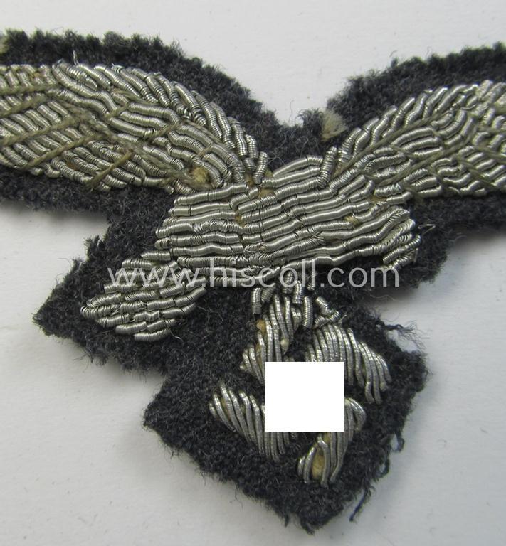 Attractive - truly used and quite detailed! - WH (Luftwaffe) officers'-pattern, visor-cap eagle (ie. 'Adler für Schirmmütze') being a neatly hand-embroidered example that comes on a typical greyish-blue-coloured- and/or woolen-based background