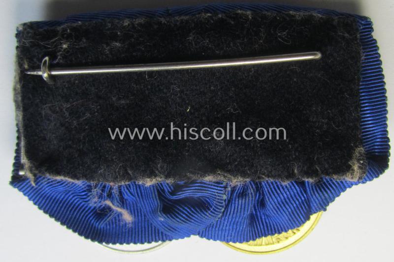 Attractive, two-pieced medal-bar (ie. 'Spange') showing two: WH (Heeres o. Kriegsmarine) so-called: 'Dienstauszeichnungen für 4 u. 12 Jahre Treue Dienste' that both come period-mounted as a so-called: 'Doppelspange'