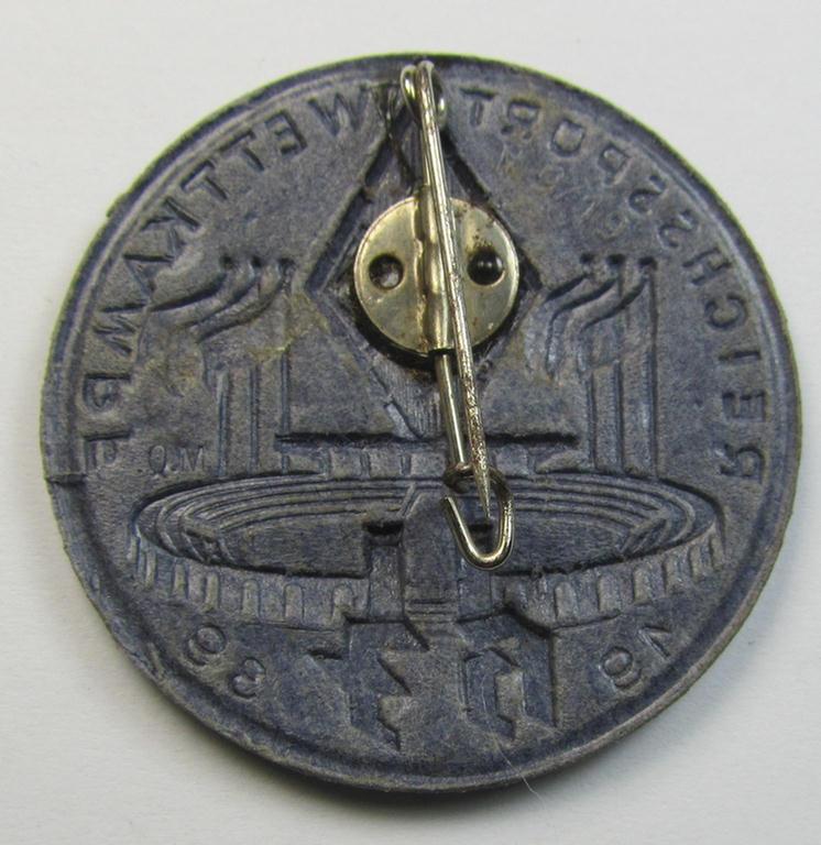 Commemorative - bluish-grey-coloured and/or: carton-based(!) - 'HJ'- (ie. Hitlerjugend-) related 'tinnie' depicting a sports-complex and 'HJ-Raute' and showing the text: 'Reichssport Wettkampf HJ - 1939'