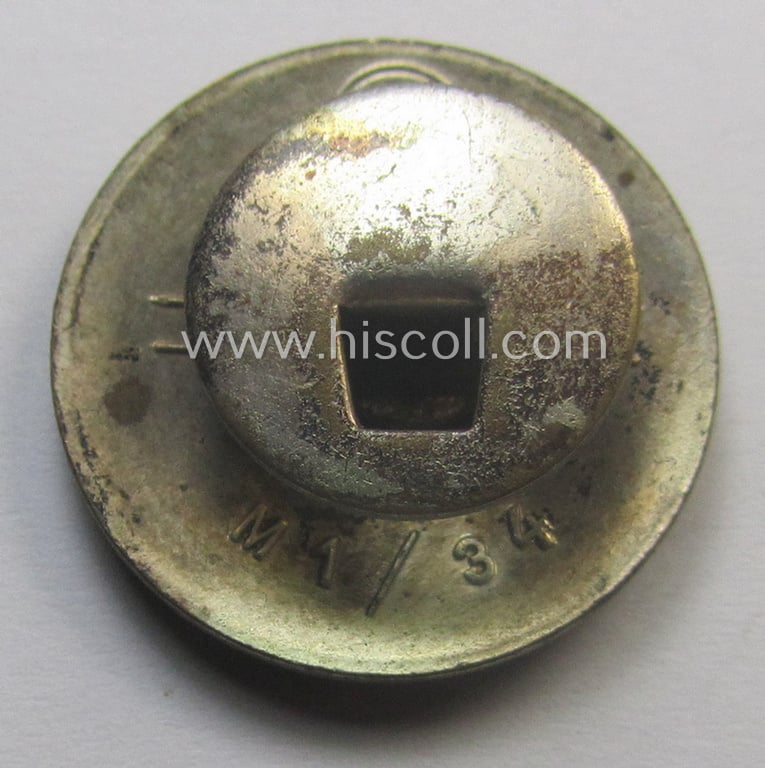 Neatly enamelled- (and bright-red-coloured!) 'N.S.D.A.P.'-membership-pin- ie. party-badge (or: 'Parteiabzeichen') which is nicely maker-marked on the back with the makers'-designation: 'RzM' and/or: 'M1/34'