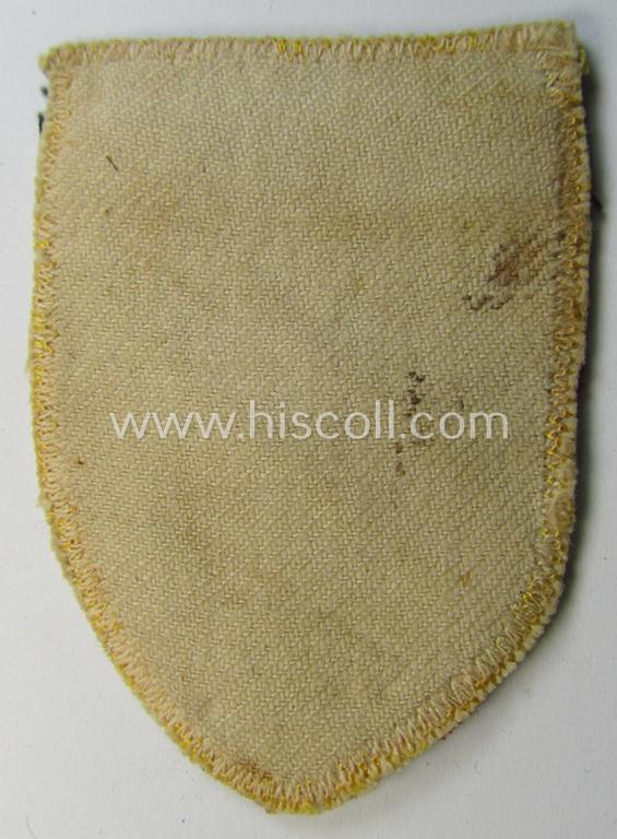 Superb - and truly rarely seen! - multi-piece-constructed, linnen-based and locally produced(!), 'Waffen-SS'-type armshield entitled: 'Latvia' as was merely intended for usage by the members of the: 'Latvian Legion'