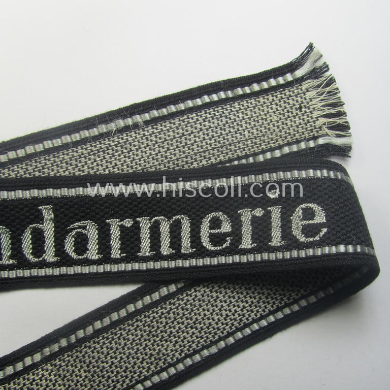 Superb - and truly rarely encountered! - example of a Waffen-SS, 'semi-BeVo'-pattern, EM- (ie. NCO-) type cuff-title (ie. 'Ärmelstreifen') as was intended for a member serving within the: 'SS-Feldgendarmerie'