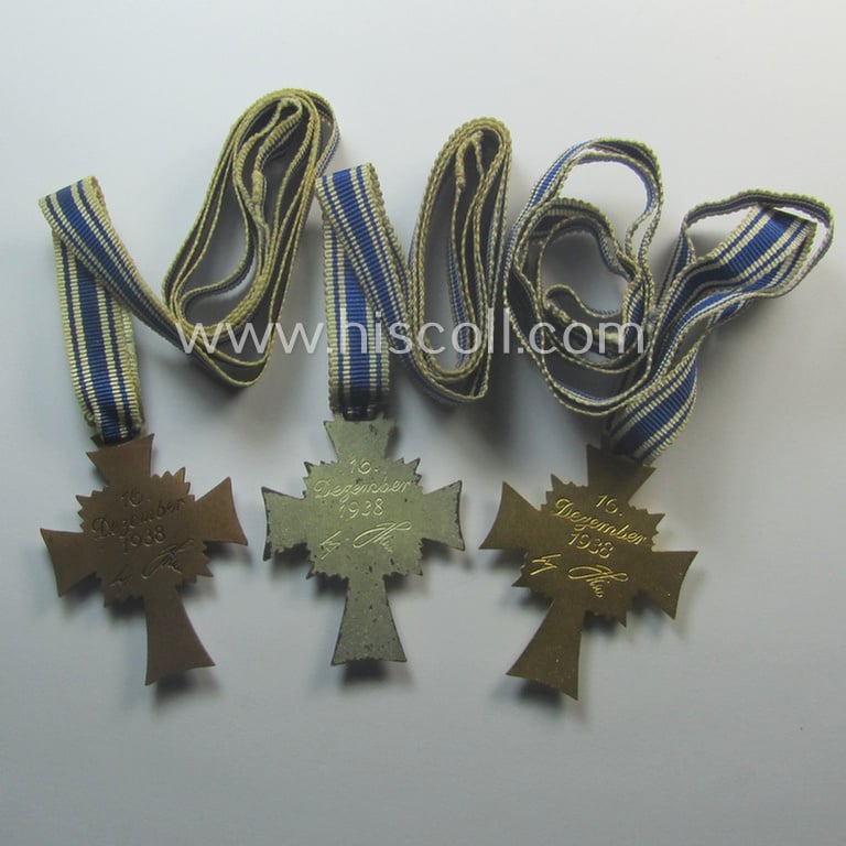 3-pieced grouping comprising of all 3 classes of the: 'Ehrenkreuz der Deutschen Mutter' (ie. bronze-, silver- and/or gold class mothers'-crosses) being all three issued- ie. worn examples