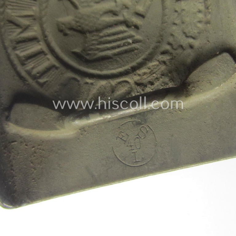 Minimally used, WH (Heeres) field-grey-coloured- and/or steel-based belt-buckle being a clearly maker-marked example that comes mounted onto its maker- (ie. 'E. Schneider - Lüdenscheid'-) marked and/or '1940'-dated leather-based tab