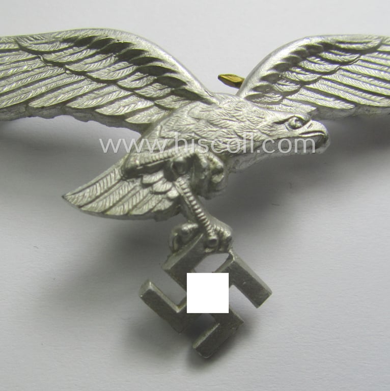 Minimally worn, WH (Luftwaffe) EM/NCO-pattern visor- (ie. 'Schirmmützen'-) cap-eagle being a maker- (ie. 'F.L.L.'-) marked example as executed in aluminium based metal