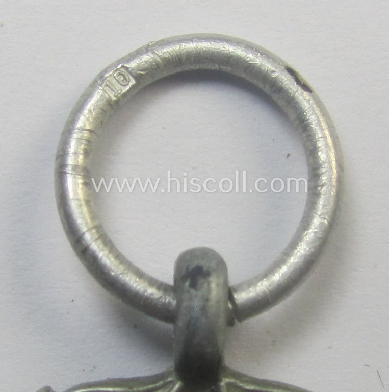 'Luftschutz-Ehrenzeichen 2. Stufe' being a maker- (ie. '10'-) marked example, as executed in (heavy) zinc-based metal (ie. 'Feinzink') and that came together with its period ribbon (ie. 'Bandabschnitt')