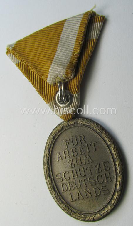 Interesting medal-set: 'Deutsches Schutzwall Ehrenzeichen' (aka: 'Westwall'-medal) being a non-maker-marked- (and/or: typical 'Buntmetall'-based) specimen that came mounted onto its (scarcely seen!) Austrian-styled and trapezoid-folded ribbon