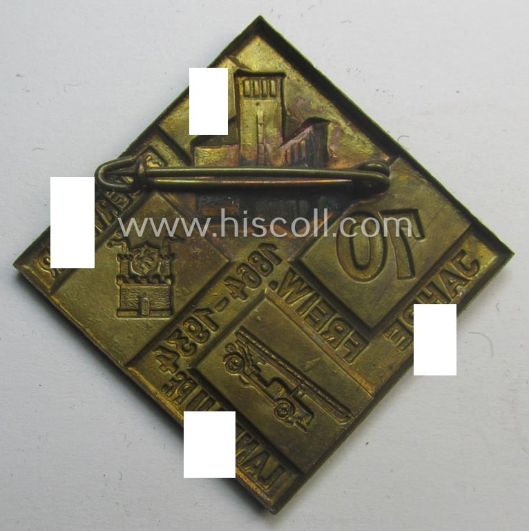 Commemorative, hollow-back- and/or golden-bronze-toned, so-called: 'Feuerwehr'-related day-badge (ie. 'tinnie') as executed in zinc-based-metal that is showing the text: '70 Jahre Freiw. Feuerwehr - 1864 - 1934 - Landau Pf.'