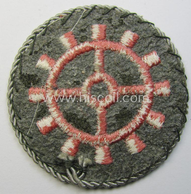 WH (Heeres ie. 'Panzer'-) trade- ie. special-career-patch having a not that often encountered (silver-coloured) 'Kordel' (ie. 'Umrandung') attached as was intended for a: 'Panzerwarte o. Kfz.-Warte o. Handwerker' (aka 'KFZ-Technisches Person...