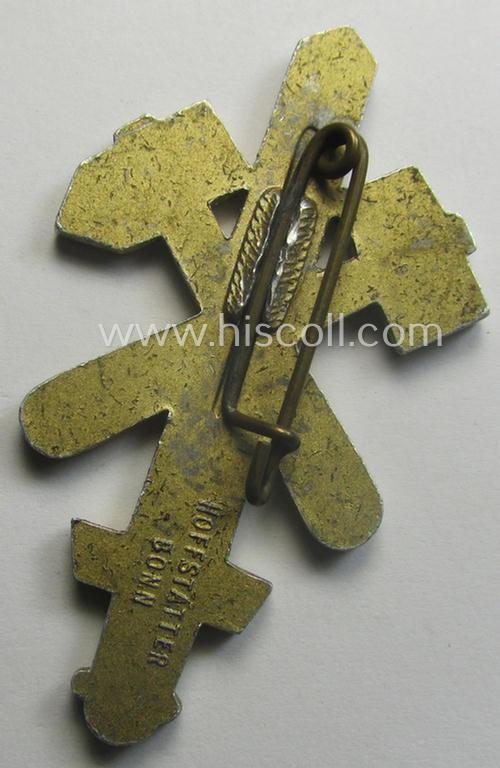 Commemorative - aluminium-based- and/or golden-toned - N.S.D.A.P.- (ie. 'Gau Essen'-) related 'tinnie', being a maker- (ie. 'Hofstätter'-) marked example depicting a sword with crossed hammers and depicting the dates: '1925-1935'