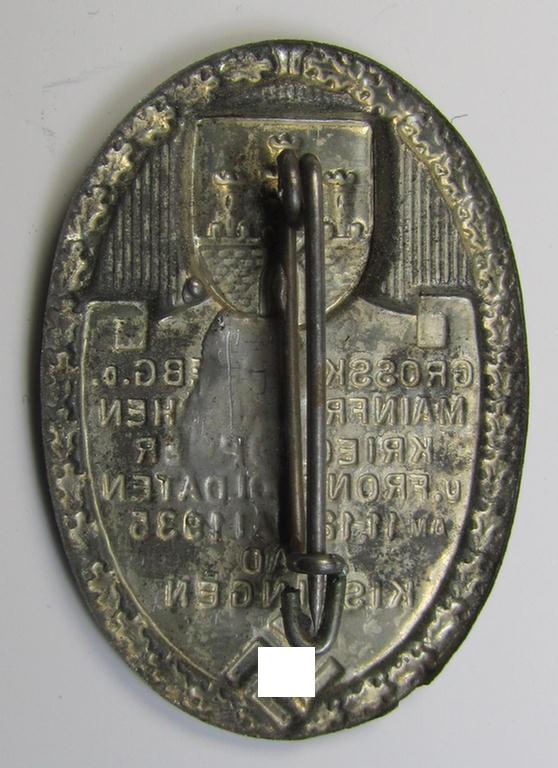 Silverish-grey-toned, N.S.K.O.V.-related day-badge (ie. 'tinnie') as was issued to commemorate a gathering entitled: 'Grosskundgebung der Mainfränkischen Kriegsopfer u. Frontsoldaten am 11.12. Mai 1935 - Bad Kissingen'