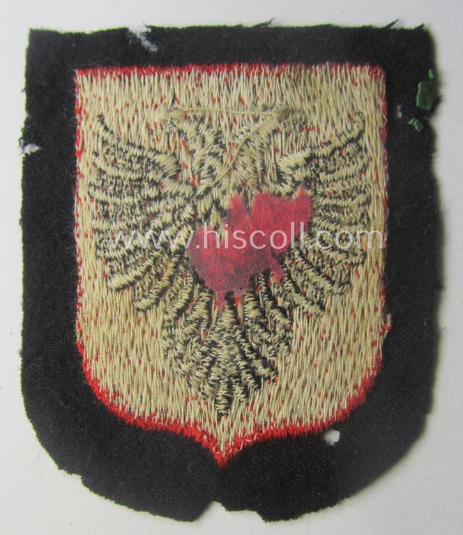 Waffen-SS 'volunteer'-arm-shield as was intended for usage by soldiers of the: '21. Waffen-Grenadier-Division der SS' “Skanderbeg” (ie. 'albanische Nr. 1') and that comes in a 'virtually mint- ie. unissued', condition