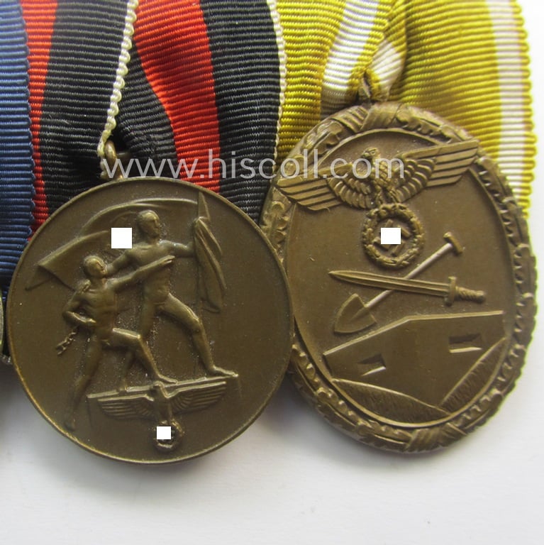 4-pieced, WH (Heeres, LW, etc.) medal-bar (ie. 'Ordenspange') showing a: 'KvK II.Kl. ohne Schw.', a: WH so-called: 'DA für 4 Jahre t. Dienste', a: WH Czech 'Anschluss'-medal: '1. Oktober 1938' and a: 'Westwall'-medal