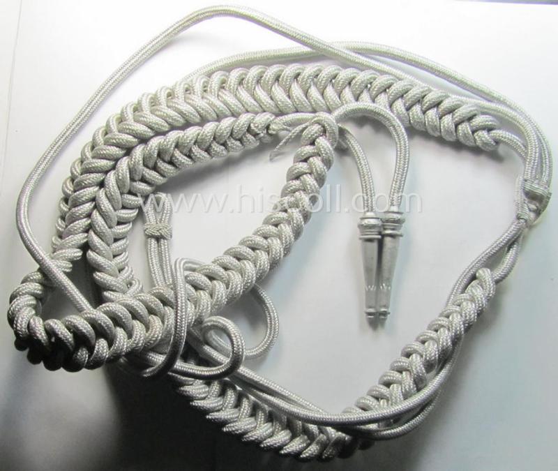 Bright-silver-toned, WH (Heeres): 'Paradefangschnur für Adjutanten' (ie. adjutants'-aiguillette) that comes stored in its period, carton box as issued