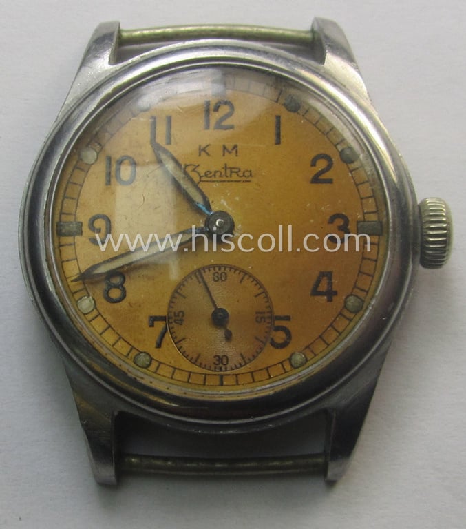 WH (Kriegsmarine) WWII-period wrist-watch (or: 'Dienstuhr') of the make: 'K.M. Zentra' having a beige-yellow-coloured dial-plate and neatly engraved number on its back that reads: '536692'