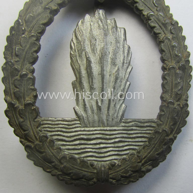 WH (Kriegsmarine) 'Kriegsabzeichen für Minensuch-, U-Boot-Jagd und Sicherungs-Verbände' being a detailed and clearly maker- (ie. 'R.K.') marked, 'Feinzink'-based example as was produced by the 'Rudolf Karneth'-company