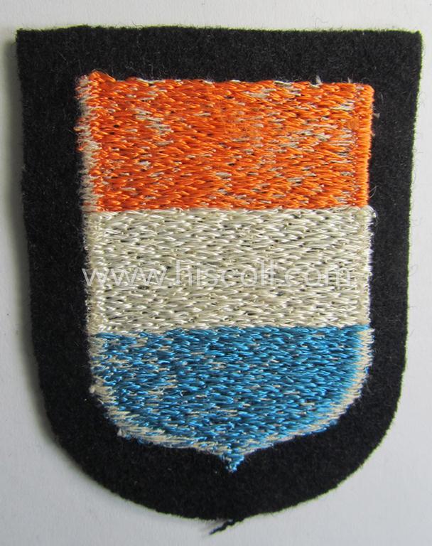 Dutch, Waffen-SS 'volunteer' arm-shield as was specifically intended for usage by soldiers of the: '23. SS Freiwilligen Panzer Grenadier Division' ('Nederland') that comes in a 'virtually mint- ie. unissued', condition