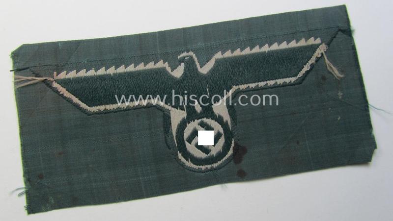 WH (Heeres) early- (ie. pre-war-) period- and/or greyish-coloured breast-eagle of the: 'M36'- (ie. 'M40'-) pattern as was executed in the 'BeVo'-weave pattern on a darker-green-coloured background