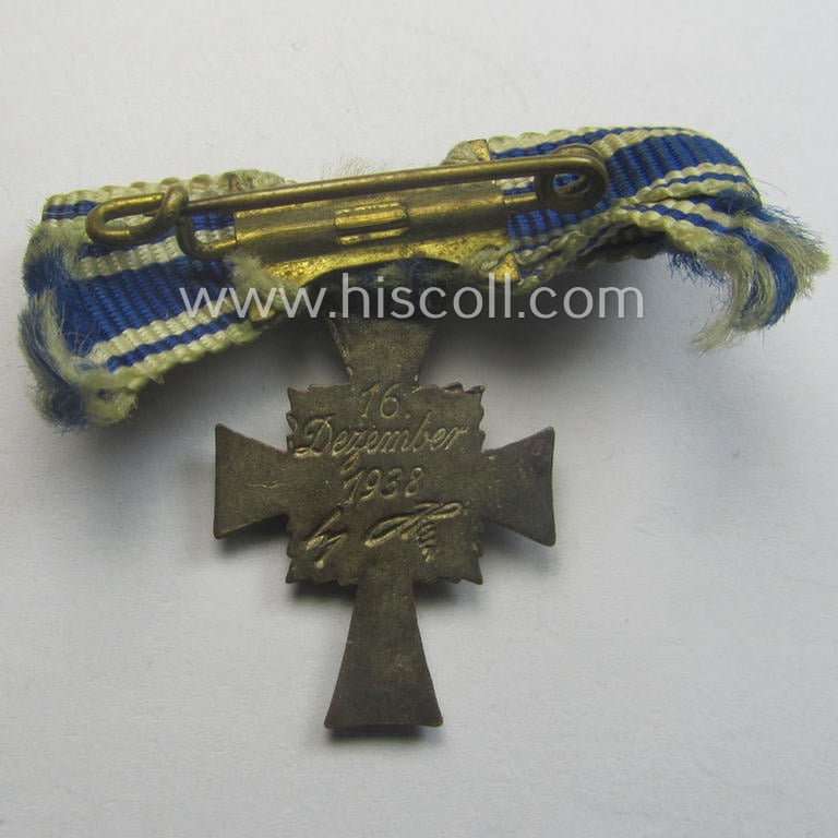 Miniature of an: 'Ehrenkreuz der deutschen Mutter - zweite Stufe' (or: silver-class mothers'-cross) being a non-maker-marked example that comes in an overall nice- (albeit moderately worn- ie. used-), condition