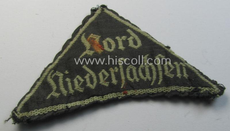 HJ/BDM ('Hitlerjugend' ie.: 'Bund Deutscher Mädel') district-triangle (ie. 'Gebietsdreieck') being an example that misses its 'RzM-etiket' and that is entitled: 'Nord Niedersachsen' and that comes in a clearly tunic- ie. shirt-removed, cond...