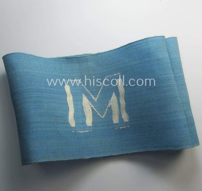 Linnen-based- and/or light-blue-coloured armband (ie. 'Armbinde') depicting an interwoven capital 'W'-character as was presumably intended for staff-members of the RLB (ie. 'Reichsluftschutz-Bund') serving as: 'RLB-Wache' (ie. air-raid-warden guard)