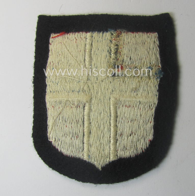 Stunning - and rarely encountered! - Waffen-SS, Norwegian 'volunteer'-armshield as was intended for usage by soldiers of (amongst others) the: '6. Gebirgs-Division der SS' (“Nord”) and that comes in a 'virtually mint- ie. unissued'-, condition