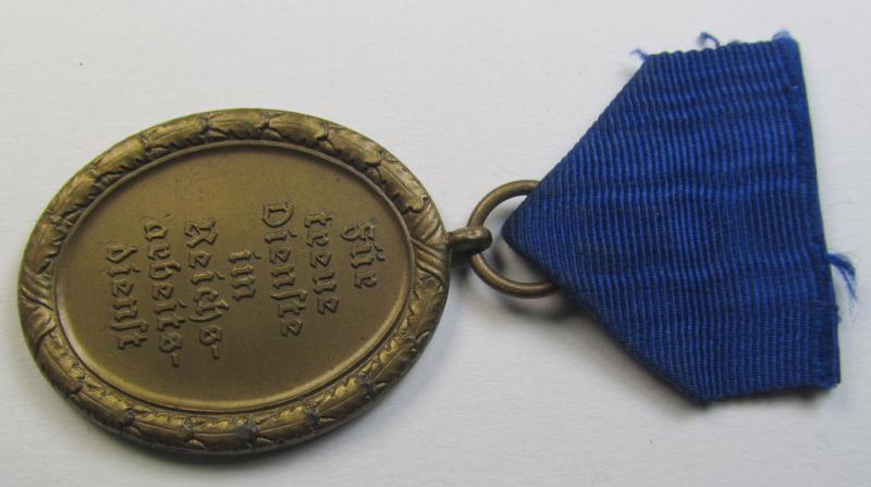 Attractive example of a: RAD (ie. 'Reichsarbeitsdienst') so-called: 'Dienstauszeichnung 4. Stufe für Männer' as was intended for 4 years loyal-service and that comes mounted onto its period piece of ribbon (ie. 'Bandabschnitt')