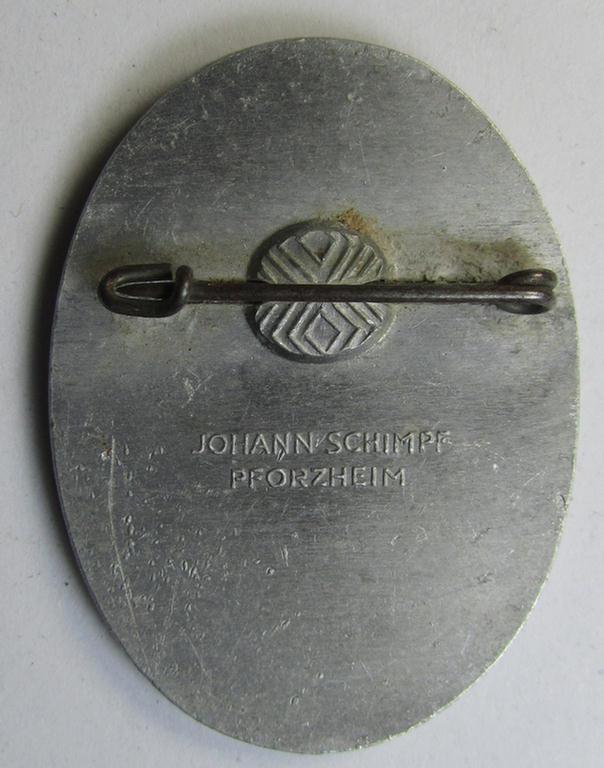 Attractive, aluminium-based- and/or: bright-silvered-toned (and maker-marked!) N.S.D.A.P.-related 'tinnie' showing a detailed knight and dragon surrounded by the text: 'Befreiungs Gaufest DRL 1935 - Saarbrücken'