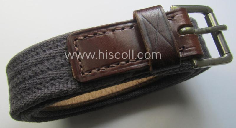 'Standard-issue'-pattern, WH trousers'-belt (or: 'Riemen für Hosen') as was executed in a combination of roughly woven blue-coloured linnen and/or brown-coloured leather