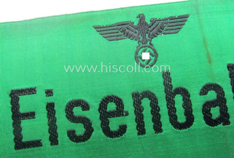 DRB- (ie. 'Deutsche Reichsbahn'-) related armband entitled: 'Eisenbahn' being of the 'entirely-woven'-type onto (typical) silk-like cloth in a technique similar to the 'BeVo'-weave pattern