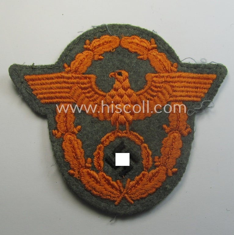 Field-police- (ie. WH-Heeres) related-) arm-eagle (ie. 'Ärmeladler') as was intended for usage by the staff of the notorious 'Feldgendarmerie-Trpn.'