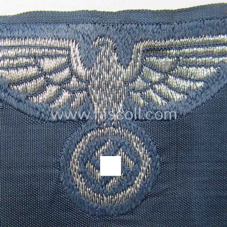 Superb, BZP (ie. 'Bahnschutz-Polizei') officers'-/ie. NCO-type side-cap- (ie. 'Schiffchen'-) eagle as woven in 'flat-wire-BeVo'-style and executed in bright-silver thread on a greyish-blue-coloured and linnen-based background