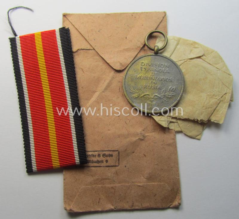 'Errinnerungsmedaille für die Spanischen Freiwilligen im Kampf gegen den Bolschevismus' being a (typical) non-maker-marked example by: 'Deschler & Sohn' in its 'Zellstoff'-based pouch