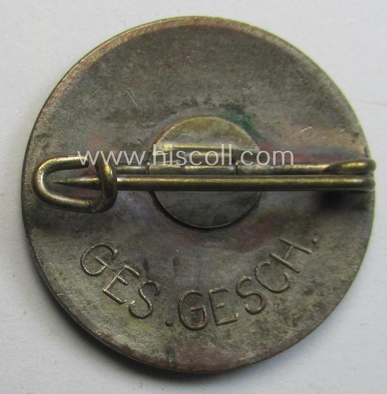 Attractive - early-period, bright-red-coloured and nicely preserved! - 'N.S.D.A.P.'-membership-pin- ie. party-badge (or: 'Parteiabzeichen') which is maker-marked on its back with just a: 'Ges.Gesch.'-patent-pending-designation