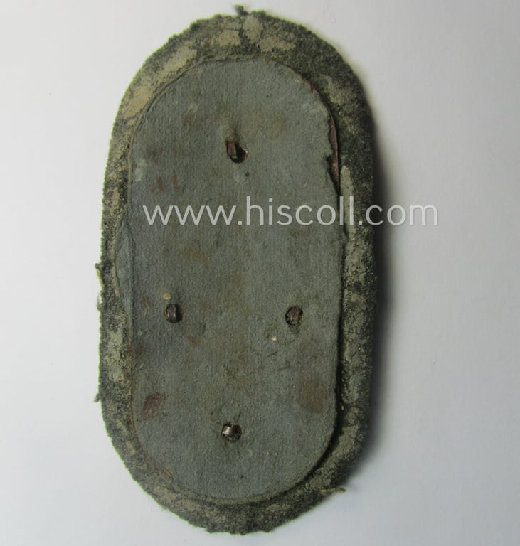 Truly used and/or worn, WH (Heeres ie. Waffen-SS) 'Demjansk'-campaign-shield (of the 'missing log'-pattern) as executed in typical magnetic metal (ie. so-called: 'Eisenblech') and that comes in an overall nice- (ie. fully untouched!), condition