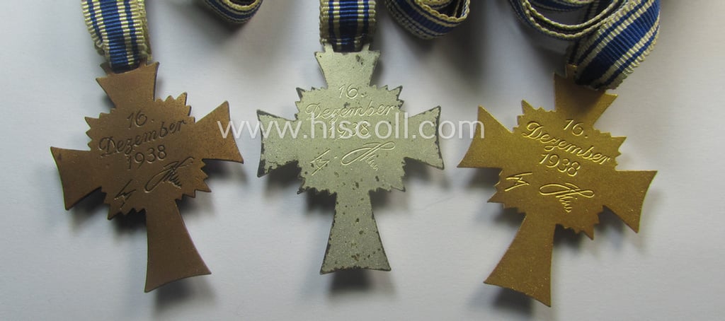 3-pieced grouping comprising of all 3 classes of the: 'Ehrenkreuz der Deutschen Mutter' (ie. bronze-, silver- and/or gold class mothers'-crosses) being all three issued- ie. worn examples
