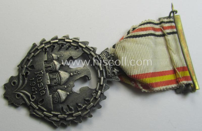 Attractive example of a Spanish-issued, campaign-medal of the Spanish Blue Division in Russia called: 'Medalla Conmemorativa Division Azul - Medalla de Tropa 1941' that comes mounted on its (typically Spanish) mounted ribbon as issued and/or worn