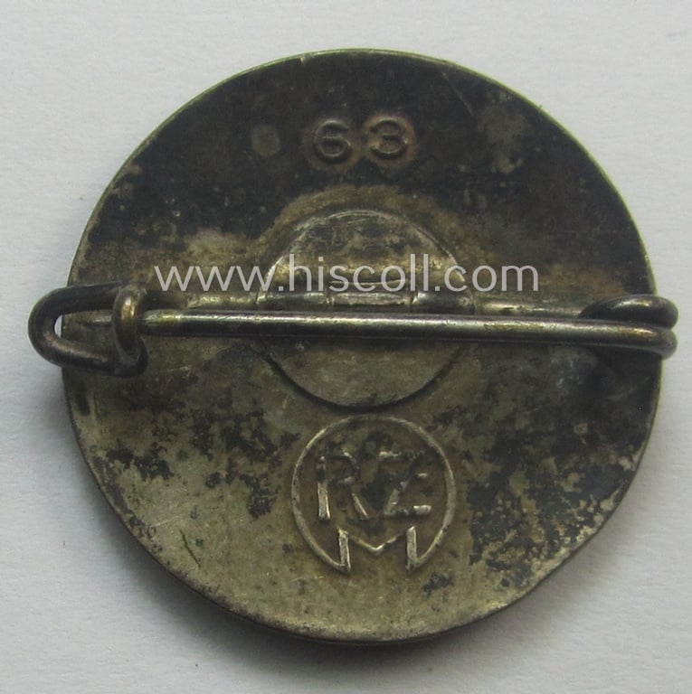Neat - bright-red-coloured and nicely preserved! - 'N.S.D.A.P.'-membership-pin- ie. party-badge (or: 'Parteiabzeichen') which is maker-marked on its back with the makers'-designation: 'RzM' and/or: 'M1/63' (ie. 'Steinhauer & Lück')