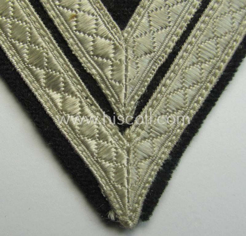 Neat - and just moderately used! - Waffen-SS- (ie. Heeres Panzer-) type 'Armwinkel' (or: rank-chevron) as executed on black-coloured wool as was intended for an: 'SS-Rottenführer' (ie. 'Obergefreiter')