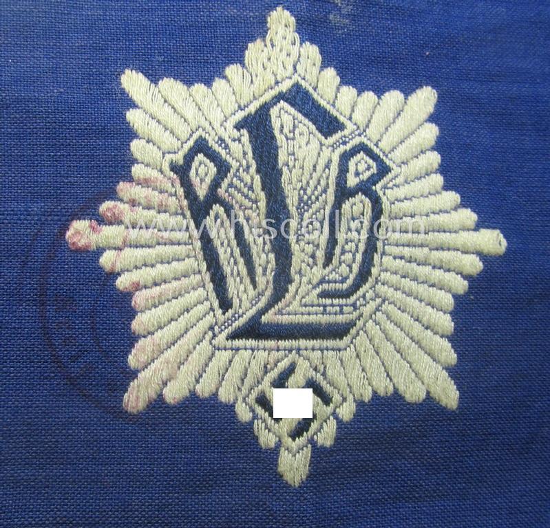 Darker-blue-coloured, RLB (or: 'Reichsluftschutzbund') so-called: 'Amtsträger-Armbinde für Führer' depicting the typical 'RLB'-logo (with lettering) and that comes in a moderately used- ie. worn, condition