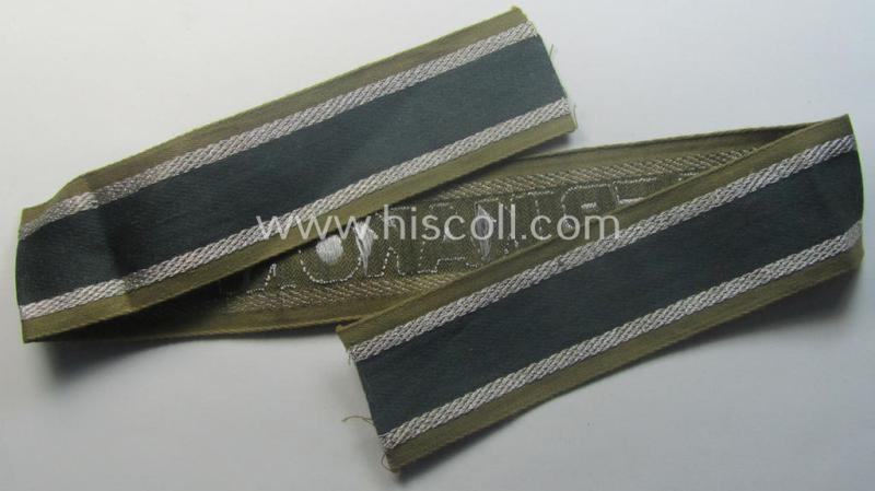 'BeVo'-like cuff-title (ie. 'Ärmelstreifen') entitled: 'Afrikakorps' being a presumably issued but simply never worn example that comes in an overall very nice- (ie. non-shortened- and never tunic-attached-), condition